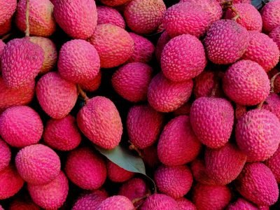 Vibrant pile of ripe lychee fruits showcasing exotic tropical abundance.
